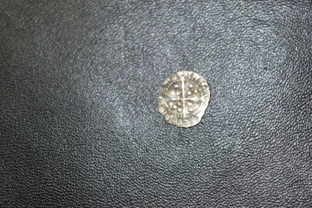 Tiny hammered, spindle whorl, nice button and a coin, not sure if it is a half penny
