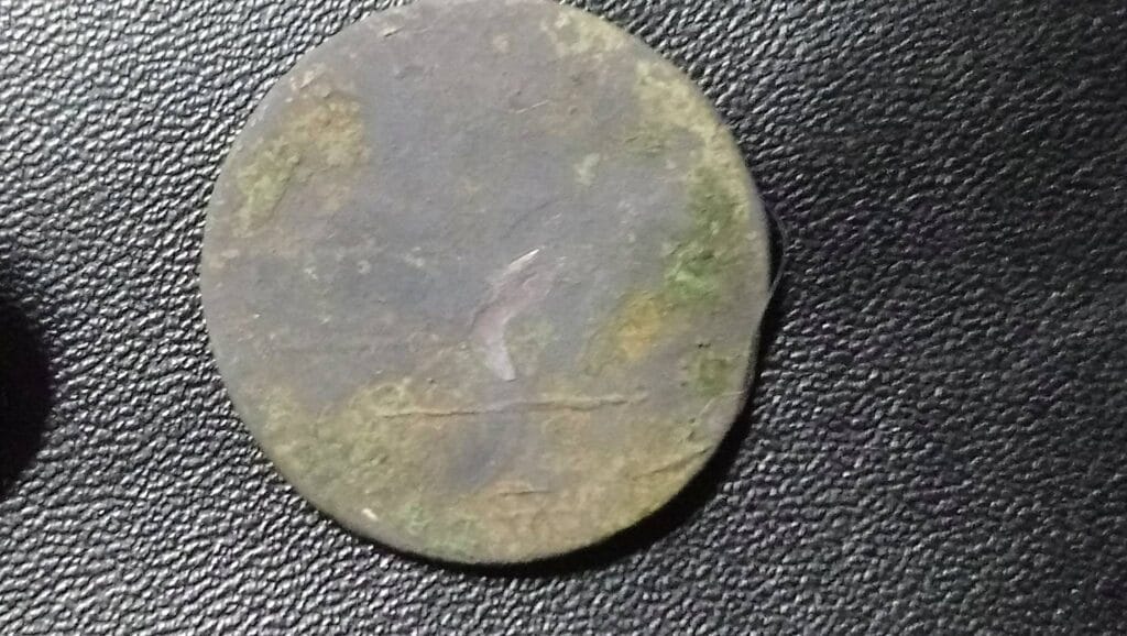 Tiny hammered, spindle whorl, nice button and a coin, not sure if it is a half penny