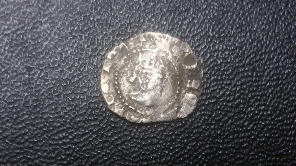 Tiny hammered, spindle whorl, nice button and a coin, not sure if it is a half penny