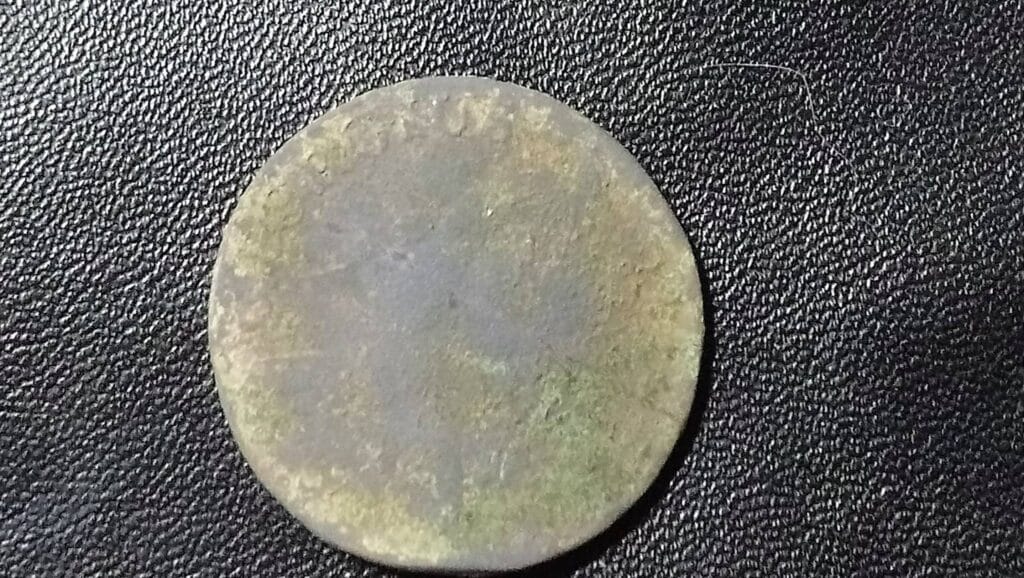 Tiny hammered, spindle whorl, nice button and a coin, not sure if it is a half penny