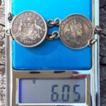 The remaining pieces of the 1910 King Edward VII Bracelet with the suspected locket on the left